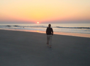 306828_2905735877990_966412_n Woman walking alone on the beach at sunrise. Knowing yourself is the beginning of all wisdom